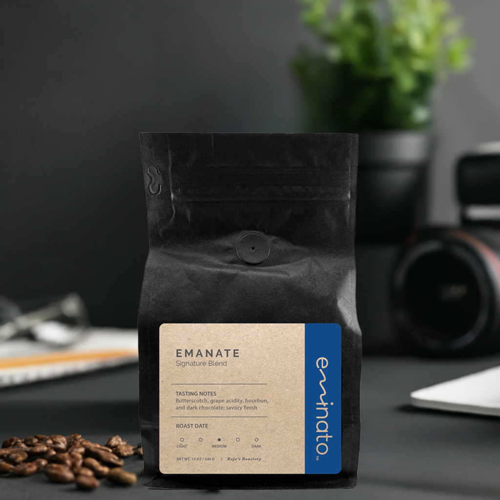 a black bag of Emanate signature blend coffee beans